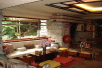 [Picture of Fallingwater living room: sitting area and fireplace]