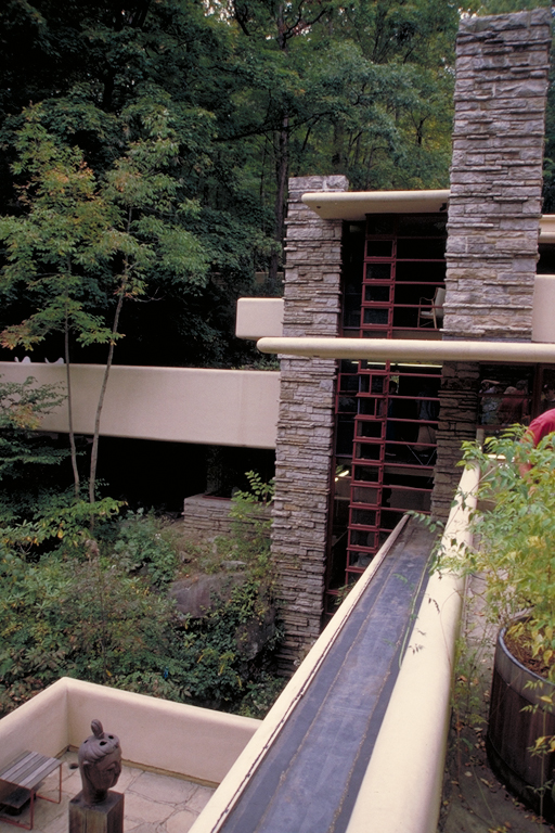 [Fallingwater west tower, and its 3-story wall of glass; eaves create dramatic horizontal lines]