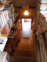 [Picture of Fallingwater third floor stairway with bookshelves]
