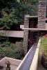 [Picture of Fallingwater's west tower and its three-story wall of glass]